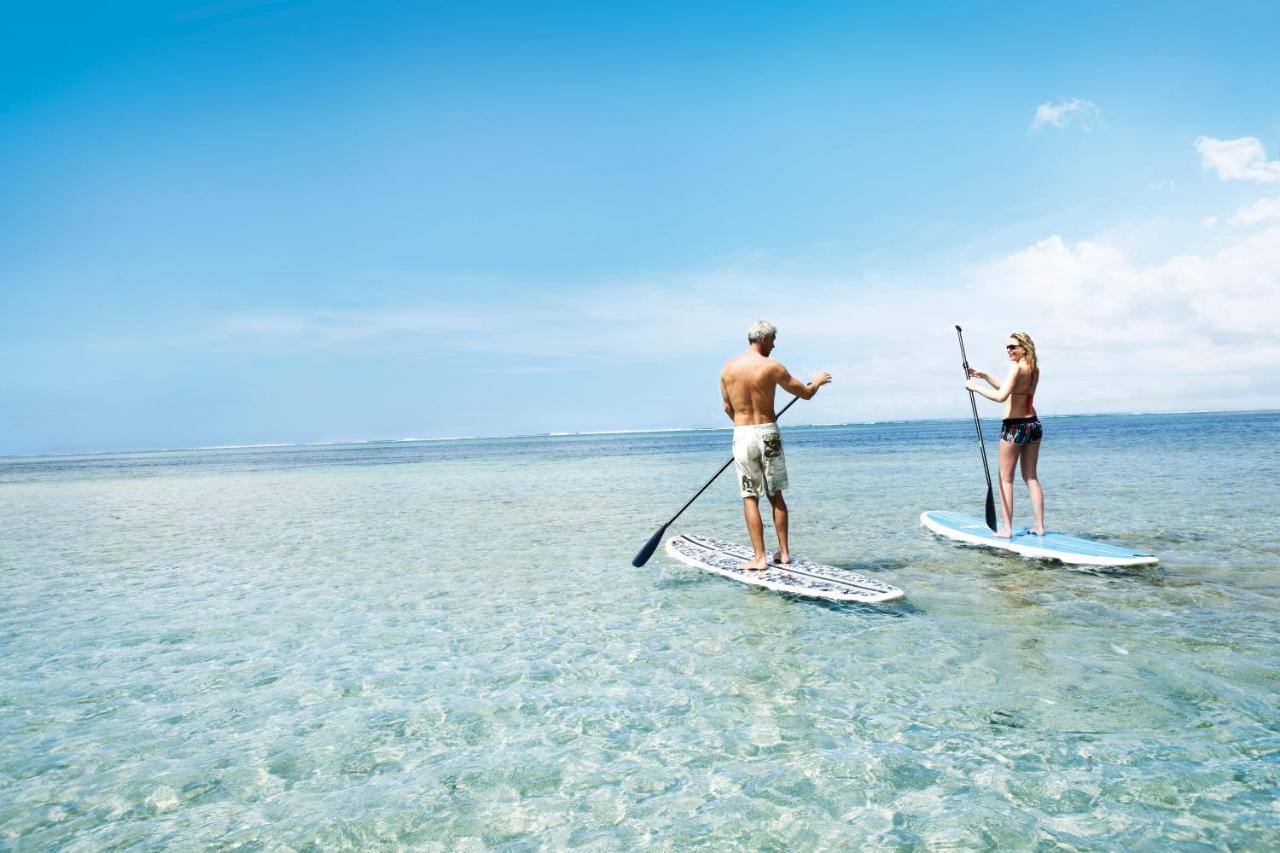 传承太妃高尔夫及健康度假村 贝尔欧布莱 外观 照片 Stand-up paddle boarders on a lagoon